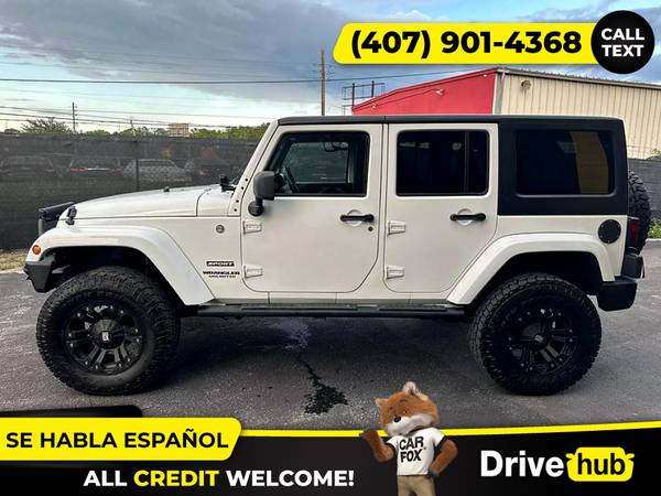 - 2014 Jeep Wrangler Unlimited Sport SUV 4D 4 D 4-D (Drive hub)