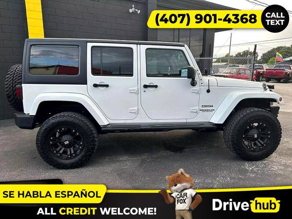 - 2014 Jeep Wrangler Unlimited Sport SUV 4D 4 D 4-D (Drive hub)