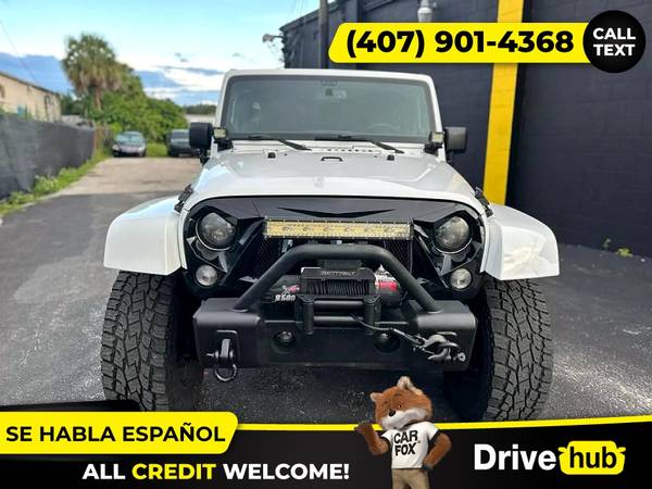 - 2014 Jeep Wrangler Unlimited Sport SUV 4D 4 D 4-D (Drive hub)