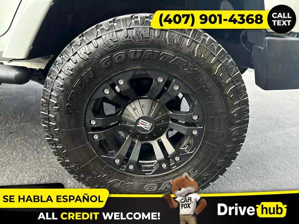 - 2014 Jeep Wrangler Unlimited Sport SUV 4D 4 D 4-D (Drive hub)