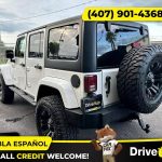 - 2014 Jeep Wrangler Unlimited Sport SUV 4D 4 D 4-D (Drive hub)