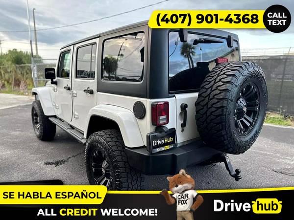 - 2014 Jeep Wrangler Unlimited Sport SUV 4D 4 D 4-D (Drive hub)