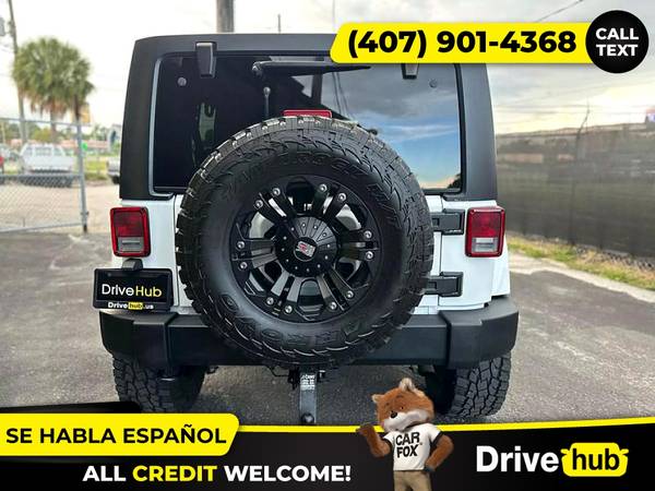 - 2014 Jeep Wrangler Unlimited Sport SUV 4D 4 D 4-D (Drive hub)